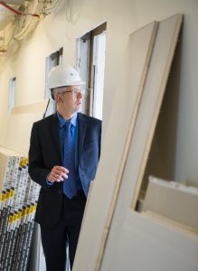 Petar Kodzas, associate dean of the Eastman Community Music School, looks over progress of the renovations at the school, which are expected to be completed by August. (Kate Melton)