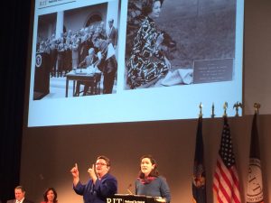 Lucinda Robb, right, speaks below photos of her parents, President and First Lady Johnson, at the rededication of National Technical Institute for the Deaf. Photo by Diana Louise Carter