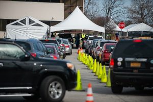 Cars line up to enter the COVID-19 testing tents at Rochester General Hospital in March. (Photo by Kate Melton)