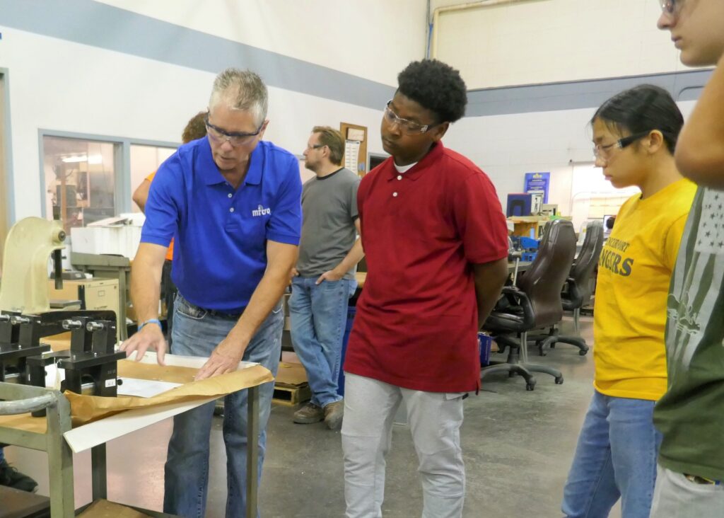 Kyle Jones, the company’s aerospace manufacturing manager who oversees the apprenticeship program, is helping to develop the industry’s next generation of thinkers and inventors. (Photo provided by Micro Instruments Inc.)