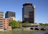 First Federal Plaza, long a familiar sight on the Rochester skyline, rises above the banks of the Genesee River. (Photo provided by CBRE Upstate NY)