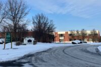 A transfer of ownership of the property at 115-125 Indigo Creek Drive became official on Tuesday. The property went up for auction in February. (File photo by Kevin Oklobzija)