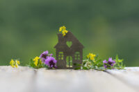 small house figure with flowers