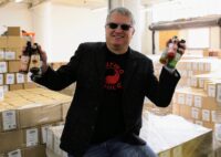 Gene Olczak, Karma Sauce founder, with an assortment of hot sauces. (Photo submitted by Karma Sauce Inc.)