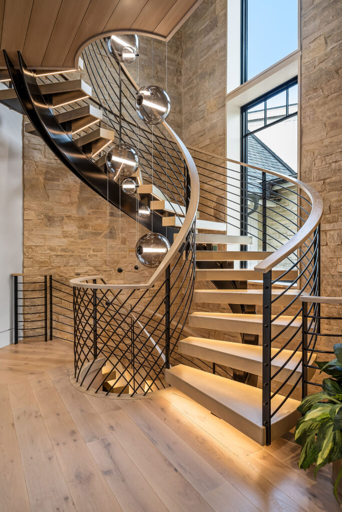A custom staircase in a lakeside home. (Photo by Ray Sehley III, R3D Media/provided by Weld Works)