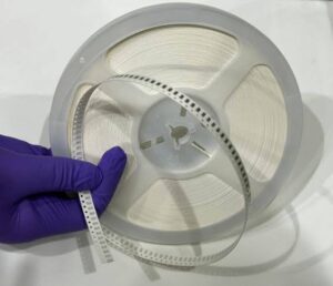 Thin-film components fabricated and precision-cut as a single unit, reel-packaged for high-throughput assembly. (Photo provided by VanaM)