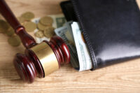 gavel with wallet and cash (Depositphotos)