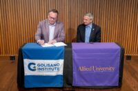 Ian Mortimer, Golisano Institute for Business & Entrepreneurship president, and Mark Zupan, Alfred University president, announced a new partnership between two schools, creating a streamlined pathway for students. (Photo provided by Golisano Institute)