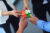 arms putting puzzle pieces together by Depositphotos