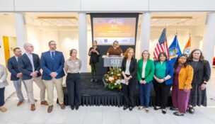 RIT is leading a consortium to build a pipeline to STEM education and careers. Donna Burnette, center, executive director of RIT’s K-12 University Center, and partners announced the consortium funded by the U.S. Department of Army STEM at a news conference on May 5. (Photo credit: Carlos Ortiz/RIT)