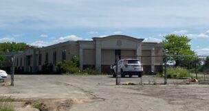 Syracuse-based Erie Materials intends to demolish the condemned hotel property at 911 Brooks Ave. and build a new warehouse and showroom. (Photo by Kevin Oklobzija)