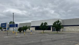 An entity associated with real estate investor David Pelusio purchased the former home of Sutherland Global and one other lot at 1180 Jefferson Road in Henrietta. (Photo by Kevin Oklobzija)