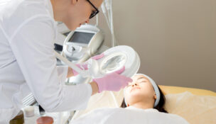 health care provider treating a patient by Depositphotos
