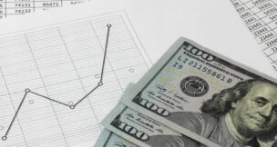 line graph with $100 bills by Depositphotos
